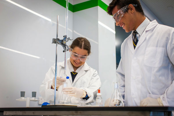 Students conducting science experiment in academic co-curricular activity at Clancy Catholic College West Hoxton