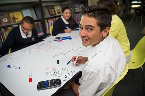 Students working on math problems at Clancy Catholic College West Hoxton