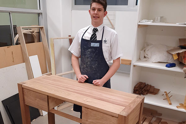 Clancy Catholic College West Hoxton student and his major project in timber technology