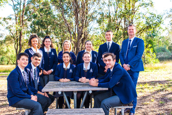 Student leadership team with principal and assistant principal at Clancy Catholic College West Hoxton